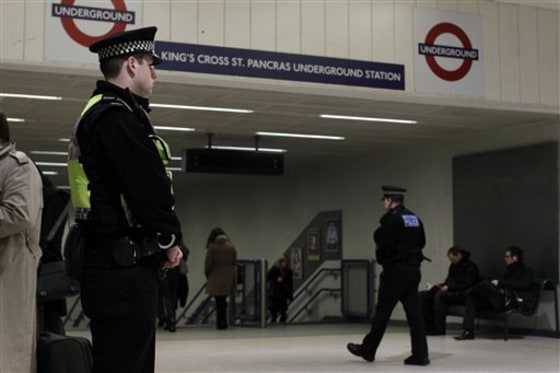 Police officers patrol by an entrance to King's Cross underground train station in London on Friday. More police officers were being deployed at transport hubs in London amid continuing fears of a terrorist attack, British media reported Thursday.